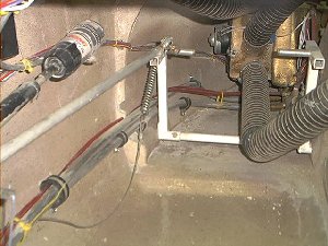Here you see the heater pipes heading along the left side. In the distance is the left side of the heater / AC / Blower box. The scat tube ducts are all in place except the lower one which will be tied up out of the way later.
