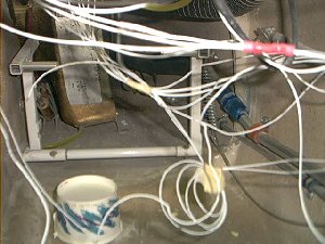 Behind all the wires you can see the AC pipes heading up the right side.