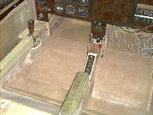 Now you see it. Now you don't. With the seats in place everything is hidden and out of the way. Note my throttle quadrant and center console are taking shape. That's Tracy's EC2 control panel set on a slant with a walnut backing. The armrest is removeable.