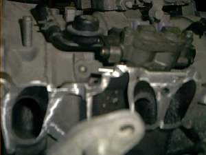 Here is the rail in place with the cut off manifold flange in place